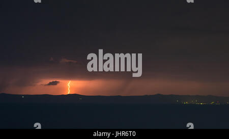 Lighting storm at night over island Hvar in Croatia Stock Photo