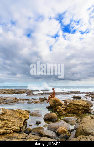 The rock pools near Margaret River river mouth with the Russell Sheridan Layla sculpture perched on a rock, Prevelly, Western Australia Stock Photo