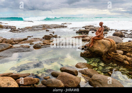 The rock pools near Margaret River river mouth with Russell Sheridan’s Layla public art sculpture on a rock, Prevelly, Western Australia Stock Photo