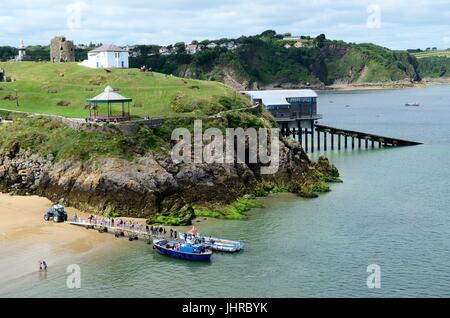 View over Tenby with boat ride from Castle Beach at low tide Pembrokeshire Wales Cymru UK GB Stock Photo