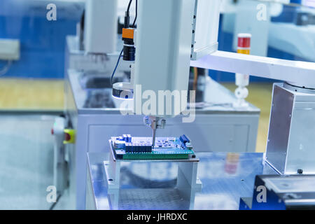 robot drill machine tool at industrial manufacture factory Stock Photo