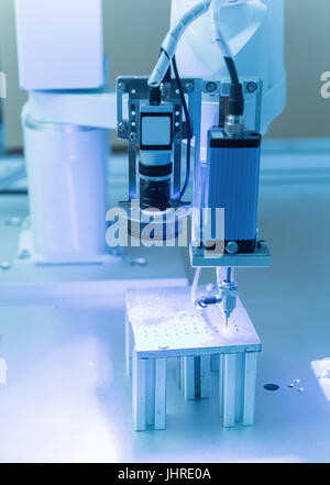 robot drill machine tool at industrial manufacture factory Stock Photo