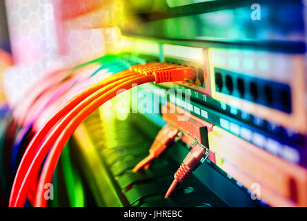 Network cables in switch and firewall in cloud computing data center server rack Stock Photo
