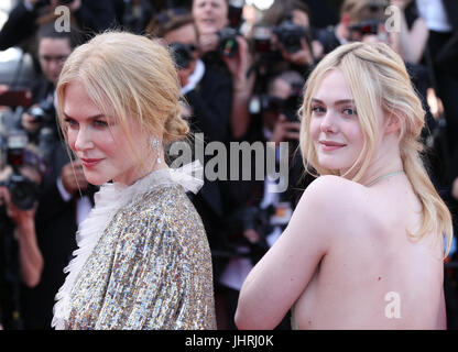 Nicole Kidman and Elle Fanning depart after the How To Talk To Girls At Parties screening during the 70th annual Cannes Film Festival at Palais des Festivals on May 21, 2017 in Cannes, France. Stock Photo
