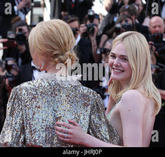 Nicole Kidman and Elle Fanning depart after the How To Talk To Girls At Parties screening during the 70th annual Cannes Film Festival at Palais des Festivals on May 21, 2017 in Cannes, France. Stock Photo