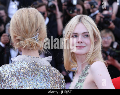 Nicole Kidman (L) and Elle Fanning depart after the How To Talk To Girls At Parties screening during the 70th annual Cannes Film Festival at Palais des Festivals on May 21, 2017 in Cannes, France. Stock Photo