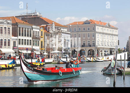 Decorative boats 'Moliceiro' carry tourists along the Central Canal Aveiro Portugal Stock Photo