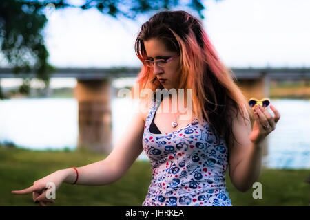 Ashley is clearly in disagreement with something, possibly an angry duck by the river. Stock Photo