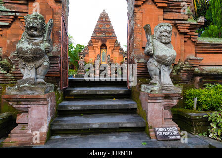 Ubud, Bali, Indonesia - May 6, 2017 : Traditional temple entrance in Ubud, known worldwide as a centre for Balinese culture, arts and crafts Stock Photo