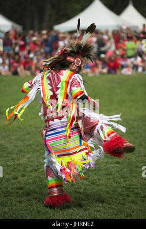 Man dancing during Canada Day powwow in Prince's Island Park.  The celebration commemorates Canada's 150th anniversary of confederation. Stock Photo