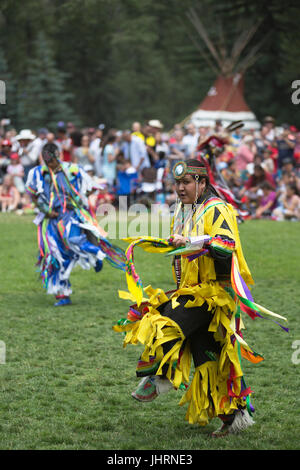 Man dancing during Canada Day powwow in Prince's Island Park.  The celebration commemorates Canada's 150th anniversary of confederation. Stock Photo