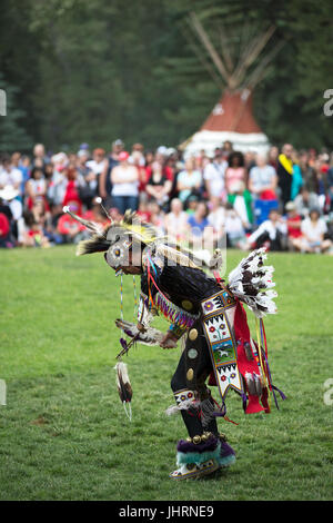 Man dancing during Canada Day powwow in Prince's Island Park.  The celebration commemorates Canada's 150th anniversary of confederation. Stock Photo