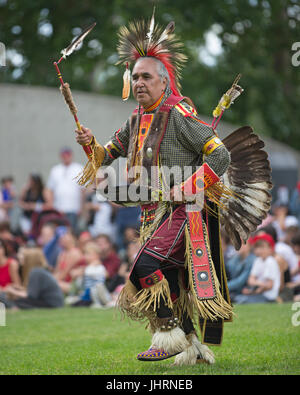 Man dancing during Canada Day powwow in Prince's Island Park.  The celebration commemorates Canada's 150th anniversary of confederation. Stock Photo