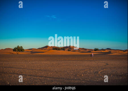 Full moon over the sand dunes of the Sahara, Merzouga, Morocco, Africa Stock Photo