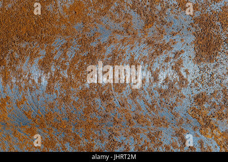 An abstract metal background with signs of wear and rust. Macro shot of metal surface. Stock Photo