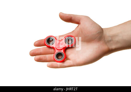 The red spinner is in hand. Hand isolated on white background Stock Photo