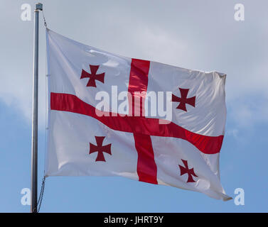 Georgian flag (Five Cross Flag) flying on flagpole, Kutaisi, Imereti Province (Mkhare), Georgia Stock Photo