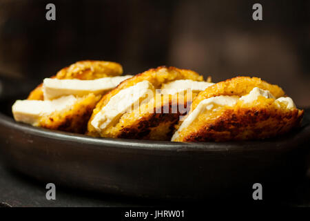 Traditional Colombian Arepa de Choclo Preparation : Arepas de choclo filled with white cheese Stock Photo