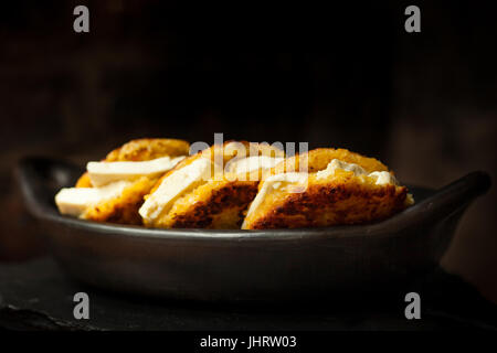 Traditional Colombian Arepa de Choclo Preparation : Arepas de choclo filled with white cheese Stock Photo