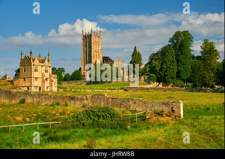 Chipping Campden in the Cotswolds, Gloucestershire and the church tower of St James seen from across farmland on a summer afternoon Stock Photo