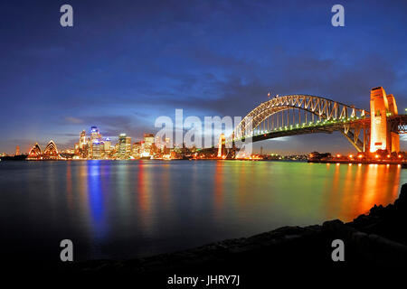 'Skyline of Sydney with Sydney opuses and Harbour bridge during the blue hour, Sydney, New South Wales, Australia; February ', Skyline von Sydney mit  Stock Photo