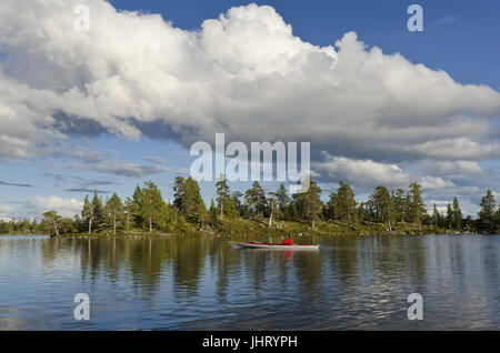Angler in the paddle boat on a lake in the natural reserve roe, Haerjedalen, Sweden, August, 2011, Angler im Paddelboot auf einem See im Naturreservat Stock Photo