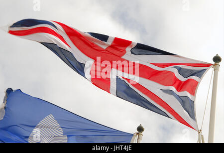 Portland, UK. 15th July, 2017. Flags fly in the steady breeze at Weymouth and Portland National Sailing Academy Credit: stuart fretwell/Alamy Live News Stock Photo