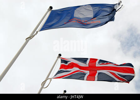 Portland, UK. 15th July, 2017. Flags fly in the steady breeze at Weymouth and Portland National Sailing Academy Credit: stuart fretwell/Alamy Live News Stock Photo