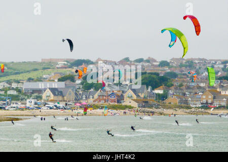 Portland, UK. 15th July, 2017. People enjoy windsurfing and kitesurfing in the fine and breezy conditions in Portland Harbour Credit: stuart fretwell/Alamy Live News Stock Photo