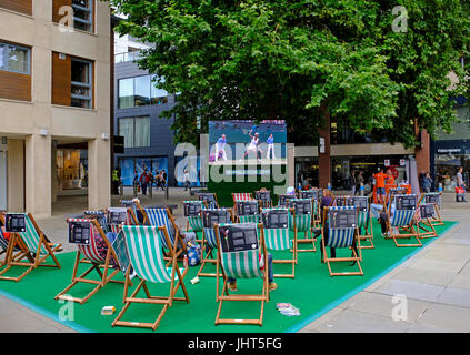 Bristol, UK. 15th July, 2017. Tennis fans watch coverage of the Wimbledon women’s singles final on an open-air television screen in the city centre. Five-times Wimbledon champion Venus Williams was defeated by Gabiñe Muguruza in two sets. Keith Ramsey/Alamy Live News Stock Photo