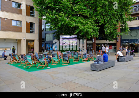 Bristol, UK. 15th July, 2017. Tennis fans watch coverage of the Wimbledon women’s singles final on an open-air television screen in the city centre. Five-times Wimbledon champion Venus Williams was defeated by Gabiñe Muguruza in two sets. Keith Ramsey/Alamy Live News Stock Photo