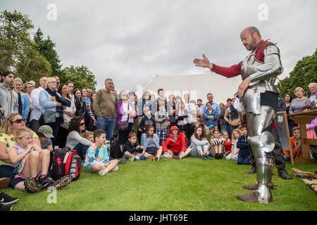 East Molesey, London, UK. 15th July, 2017. A Knight prepares by suiting up with battle armour ready for the Tudor Joust at Hampton Court Palace © Guy Corbishley/Alamy Live News
