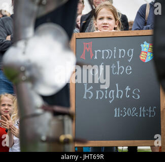 East Molesey, London, UK. 15th July, 2017. A Knight prepares by suiting up with battle armour ready for the Tudor Joust at Hampton Court Palace © Guy Corbishley/Alamy Live News