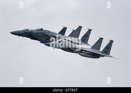 Three F-15 jet fighter planes of the US Air Force from RAF Lakenheath, Suffolk, UK carry out a flypast at an airshow Stock Photo