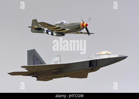 US Air Force Lockheed Martin F-22 Raptor stealth fighter with a North American P-51 Mustang second world war plane as a heritage flight displaying at an airshow Stock Photo