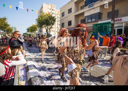 LIMASSOL, CYPRUS - FEBRUARY 26: Happy people in teams dressed with colorfull costumes at famous, February 26, 2017 in Limassol Stock Photo