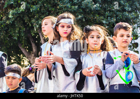 LIMASSOL, CYPRUS - FEBRUARY 26: Happy people in teams dressed with colorfull costumes at famous, February 26, 2017 in Limassol Stock Photo