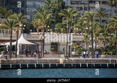 Palm trees and cafes on the harbourfront at Cartagena in Murcia Spain Stock Photo