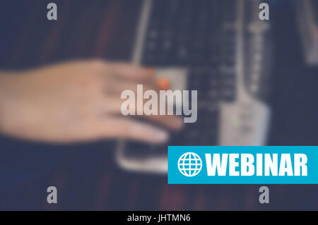 webinar with blurring hand writing on keyboard in office, online education concept, e-Learning, personal development Stock Photo