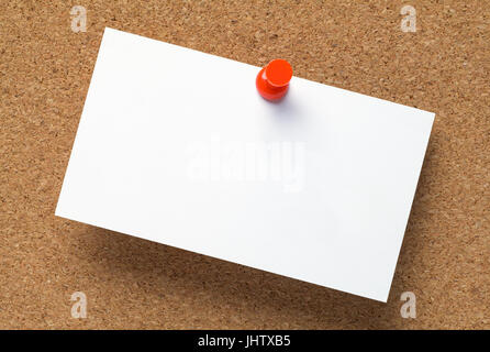 Blank Business Card Tacked to Brown Corkboard. Stock Photo
