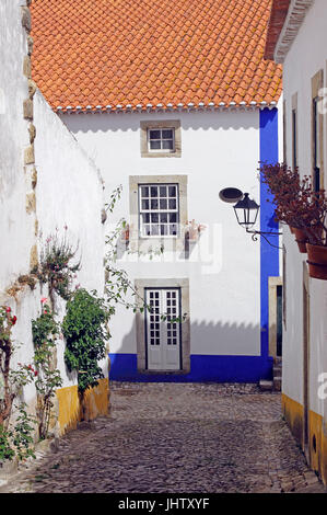 Narrow stone streets whitewashed village of Obidos Estremadura Portugal Stock Photo