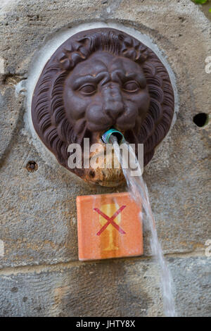 Ancient spring water fountain in Rue de Porche, Grimaud, France Stock Photo