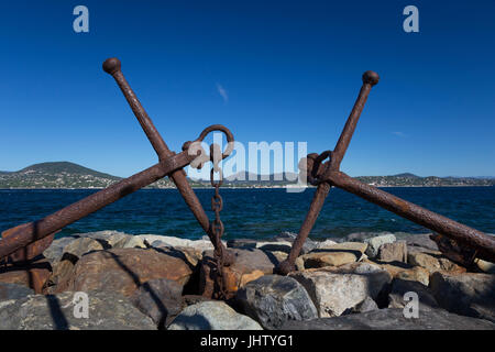 Old anchors on The Môle Jean Réveille, Saint-Tropez harbour, France Stock Photo