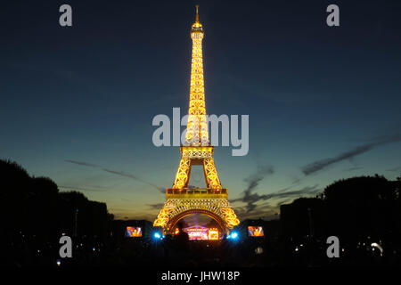 Famous Eiffel Tower during celebrations of French national holiday - Bastille Day. Stock Photo