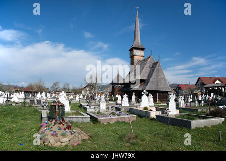 Rozavlea wooden church and cemetery, District of Maramures, Romania Stock Photo