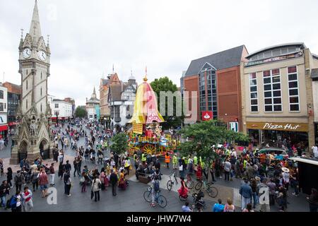 The Hare Krishna Festival of Chariots gets under way as festival-goers gather to dance and pull a 40ft chariot through Leicester City Centre in Leicester. Stock Photo