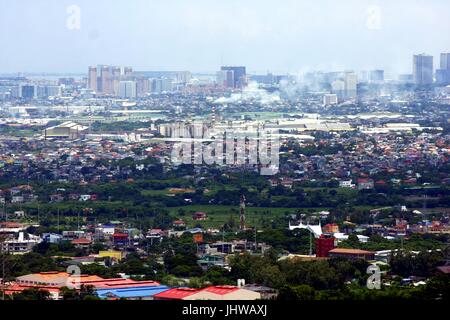 ANTIPOLO CITY, PHILIPPINES - JULY 13, 2017: An aerial view of commercial and residential buildings and establishments in the towns of Cainta, Taytay,  Stock Photo