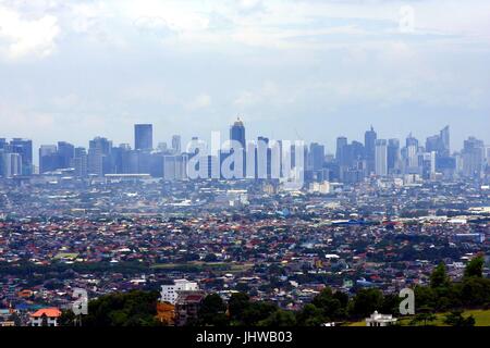 ANTIPOLO CITY, PHILIPPINES - JULY 13, 2017: An aerial view of commercial and residential buildings and establishments in the towns of Cainta, Taytay,  Stock Photo