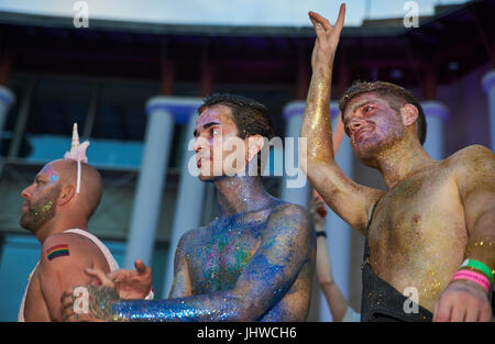 BRISTOL, ENGLAND - JULY 8: Three gay men in costume dancing at Bristol Pride in Bristol on July 8, 2017 Stock Photo
