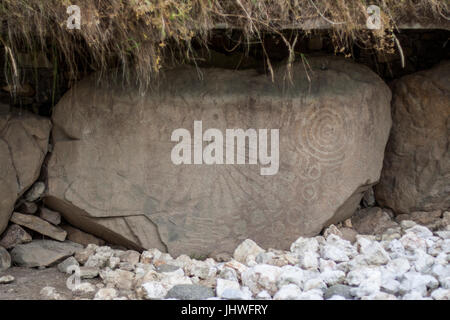 Neolithic art displayed on large stones, Kerbstones with spirals and lozenges at Knowth, Boyne Valley, Meath Ireland Stock Photo